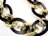 Chain Link Statement Necklace Classic necklace features a golden and black toned chain
