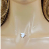 White puzzle piece pendant on a clear necklace. Lab Created Opal Puzzle Pendant Floating Illusion Necklace.