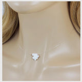 White puzzle piece pendant on a clear necklace. Lab Created Opal Puzzle Pendant Floating Illusion Necklace.