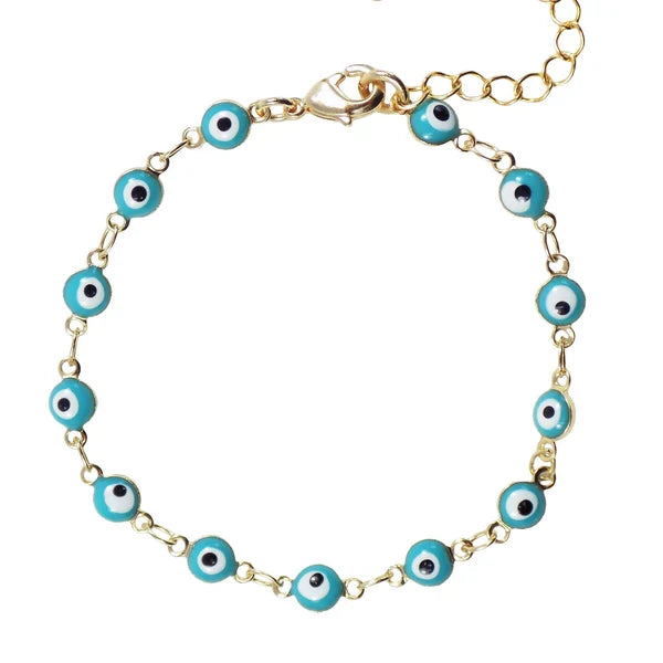 Turquoise evil eye bracelet with tiny nazar charm on a clean white background, showing the gold‑plated chain and enamel detail.