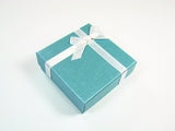 Blue evil eye bracelet packaged inside a Martinuzzi gift box, showing ready‑to‑gift presentation