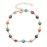 Multicolor evil eye bracelet with tiny Turkish nazar charms on a gold‑plated chain, displayed on a white background.