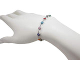 Multicolor evil eye bracelet worn on wrist showing size and fit