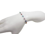 Multicolor evil eye bracelet worn on wrist showing size and fit