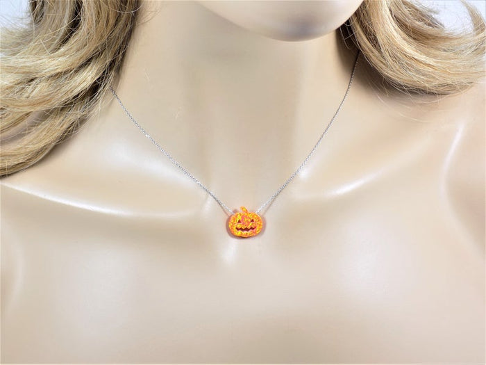 Opal pumpkin necklace displayed on a mannequin, showing how the chain sits when worn.